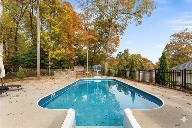 a view of a swimming pool with a patio