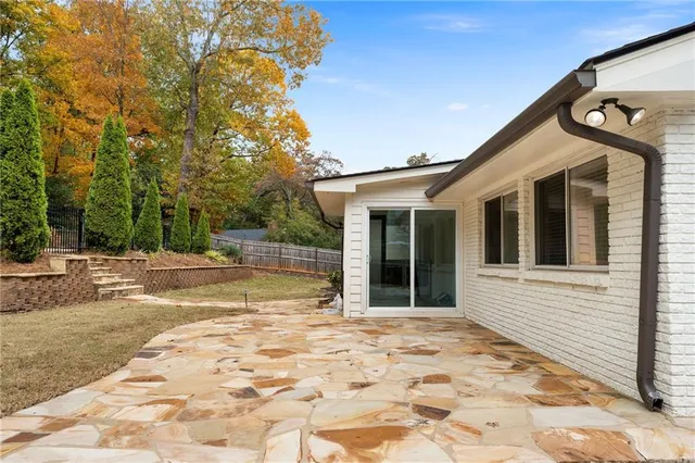 a view of a house with basketball court