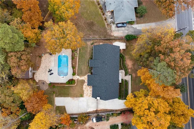 an aerial view of residential houses with outdoor space