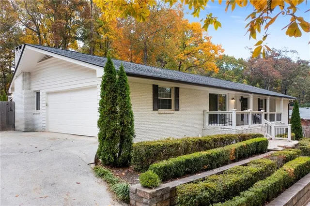a front view of a house with garden