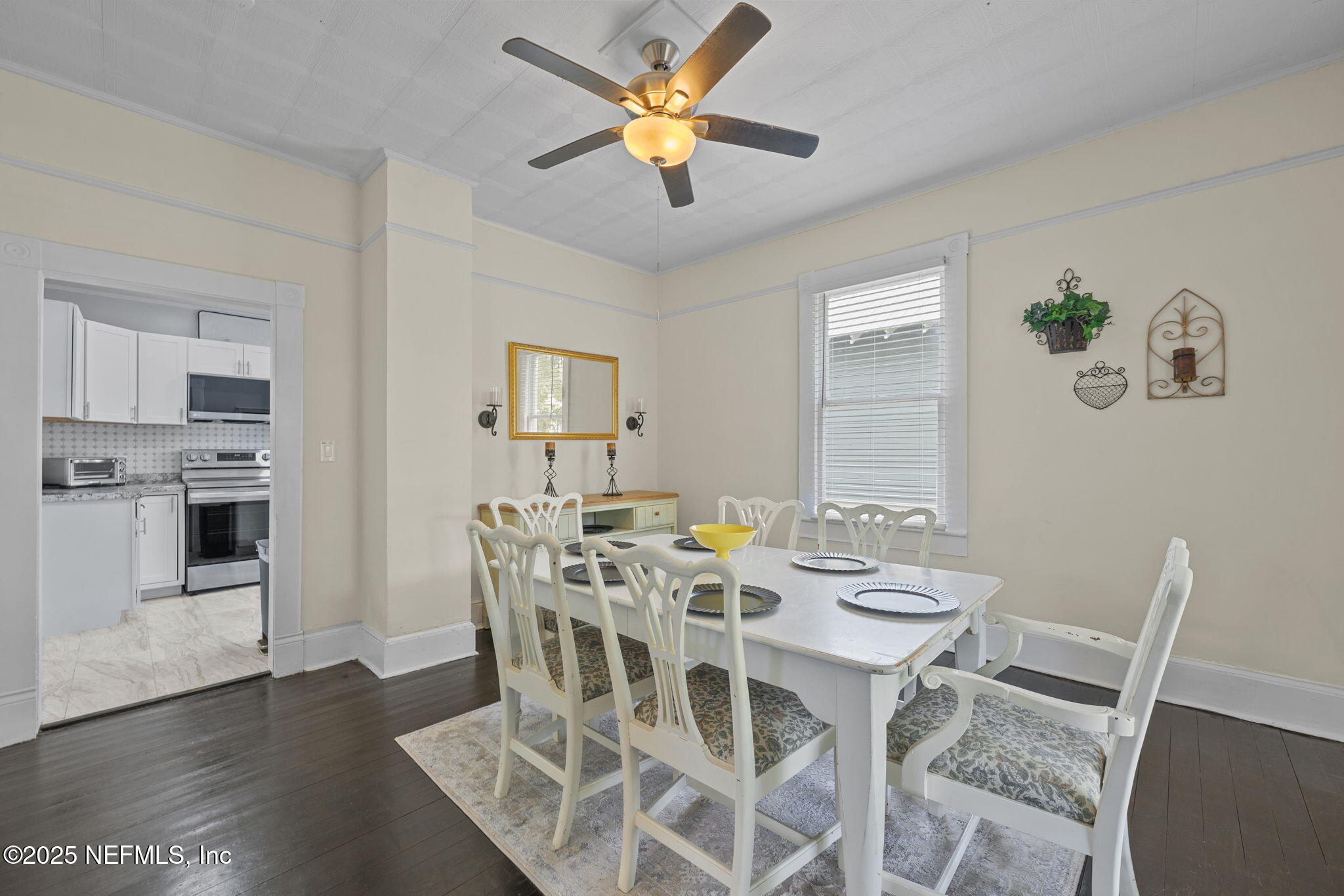 313 Madison Street Palatka, FL 32177 - Photo 6 of 38 a view of a dining room with furniture and wooden floor