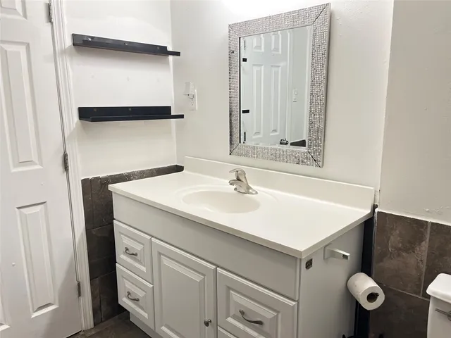 a bathroom with a sink and a mirror