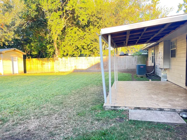 a house view with a backyard space