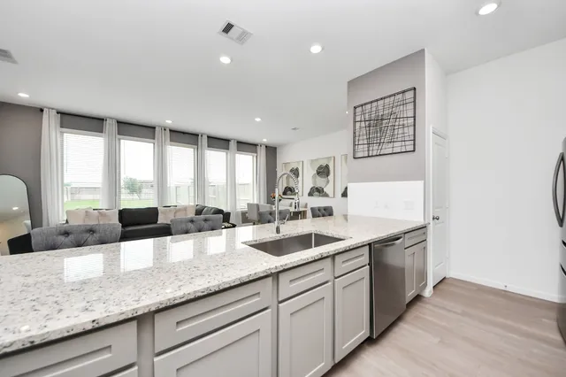a kitchen with lots of counter space and window