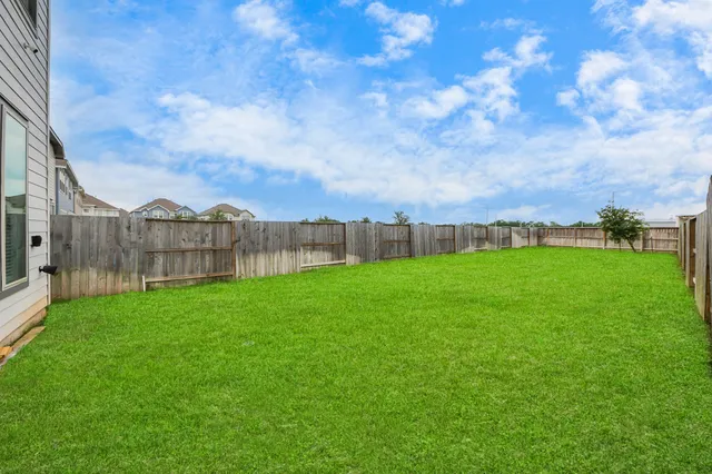 a view of a back yard with an outdoor space
