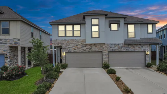 a front view of a house with garage