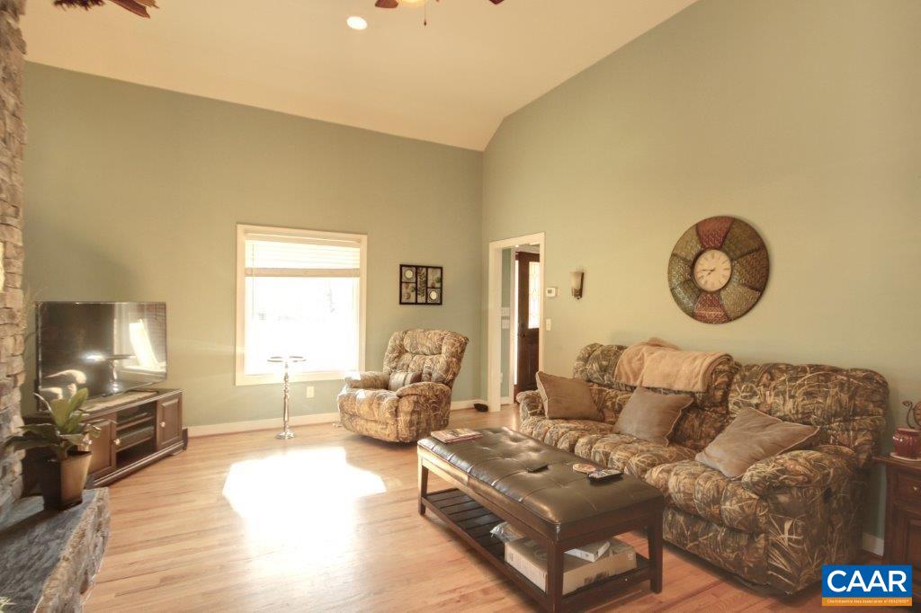 3501 Buck Island Road Charlottesville, VA 22902 - Photo 3 of 32 a living room with furniture and a flat screen tv