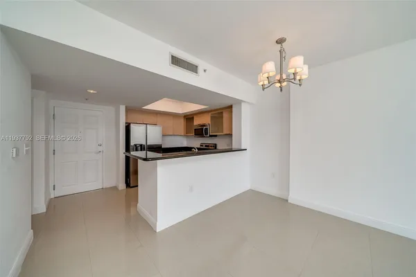 a view of a kitchen with a sink and dishwasher