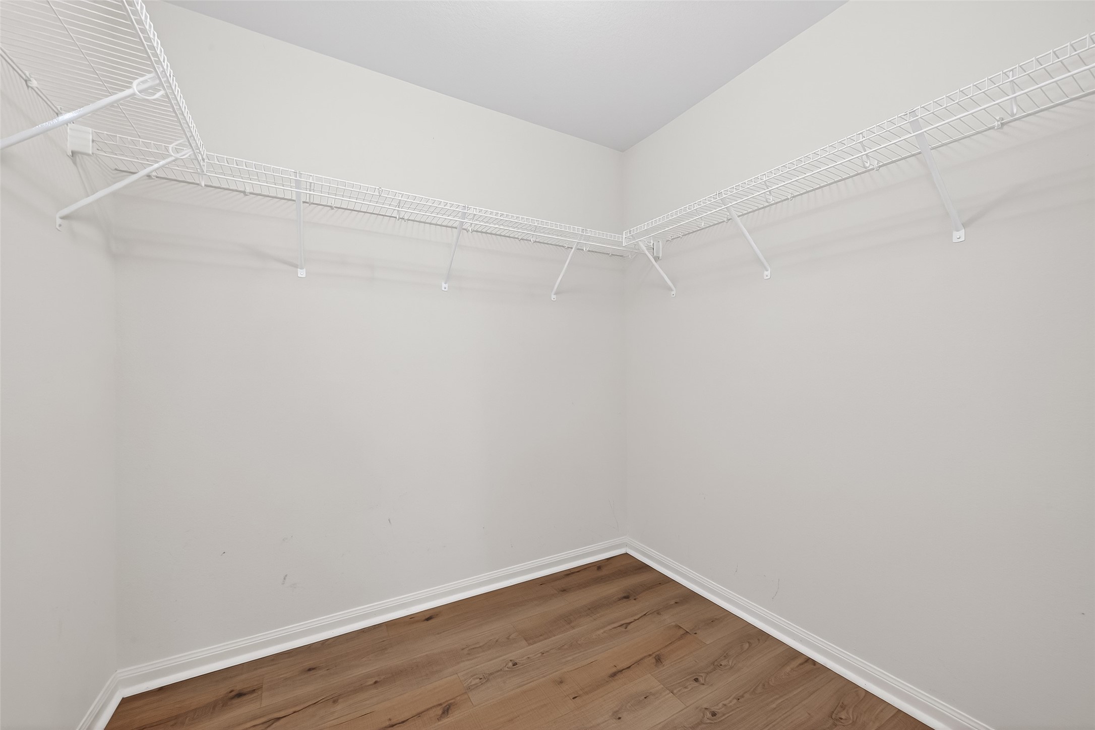 4918 Jagged Cliff Lane Rosenberg, TX 77469 - Photo 15 of 23 a view of a room with wooden floor