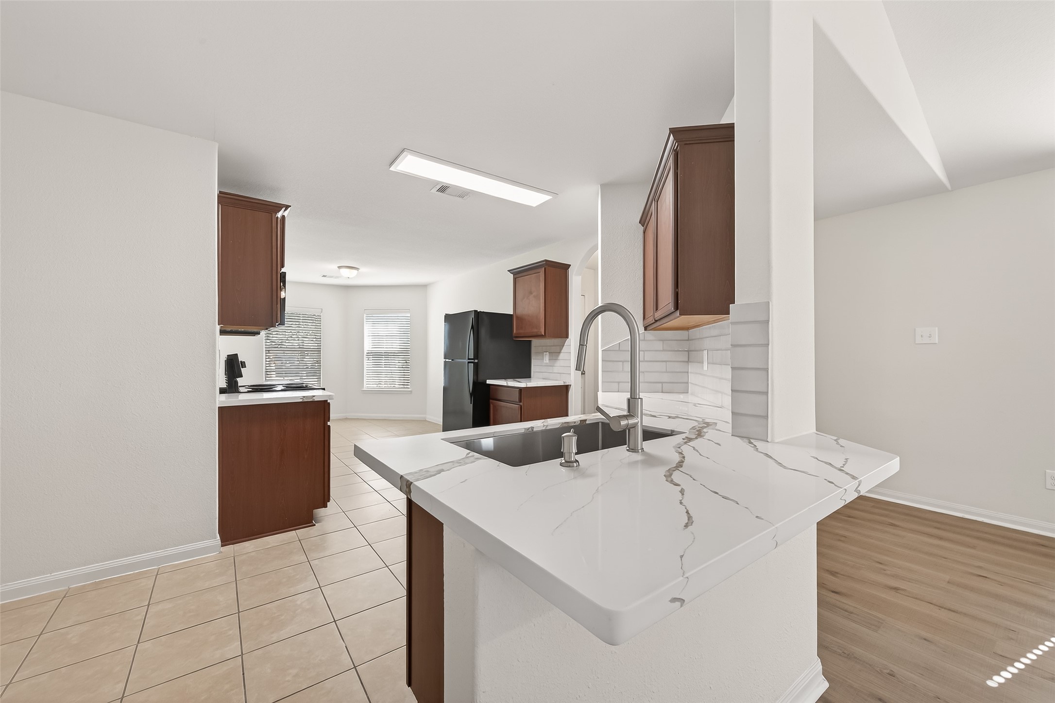 4918 Jagged Cliff Lane Rosenberg, TX 77469 - Photo 6 of 23 a view of a kitchen with a sink