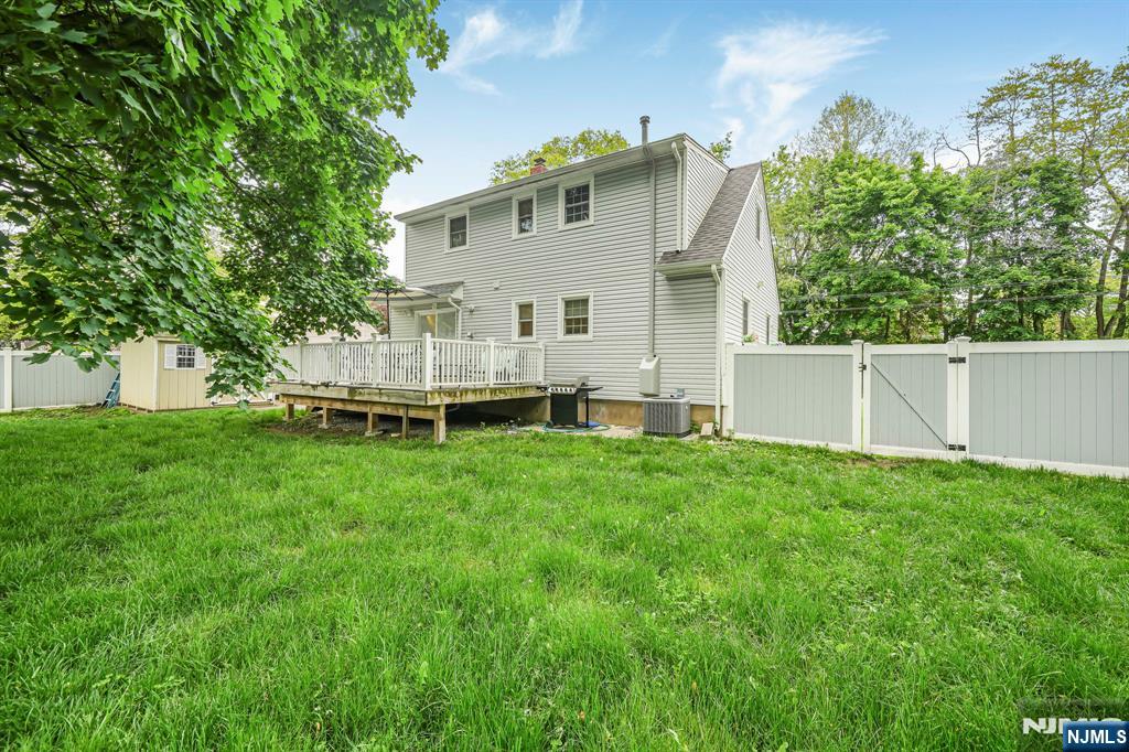 52 Barbara Drive Pompton Lakes, NJ 07442 - Photo 24 of 30 a view of a house with backyard and a garden