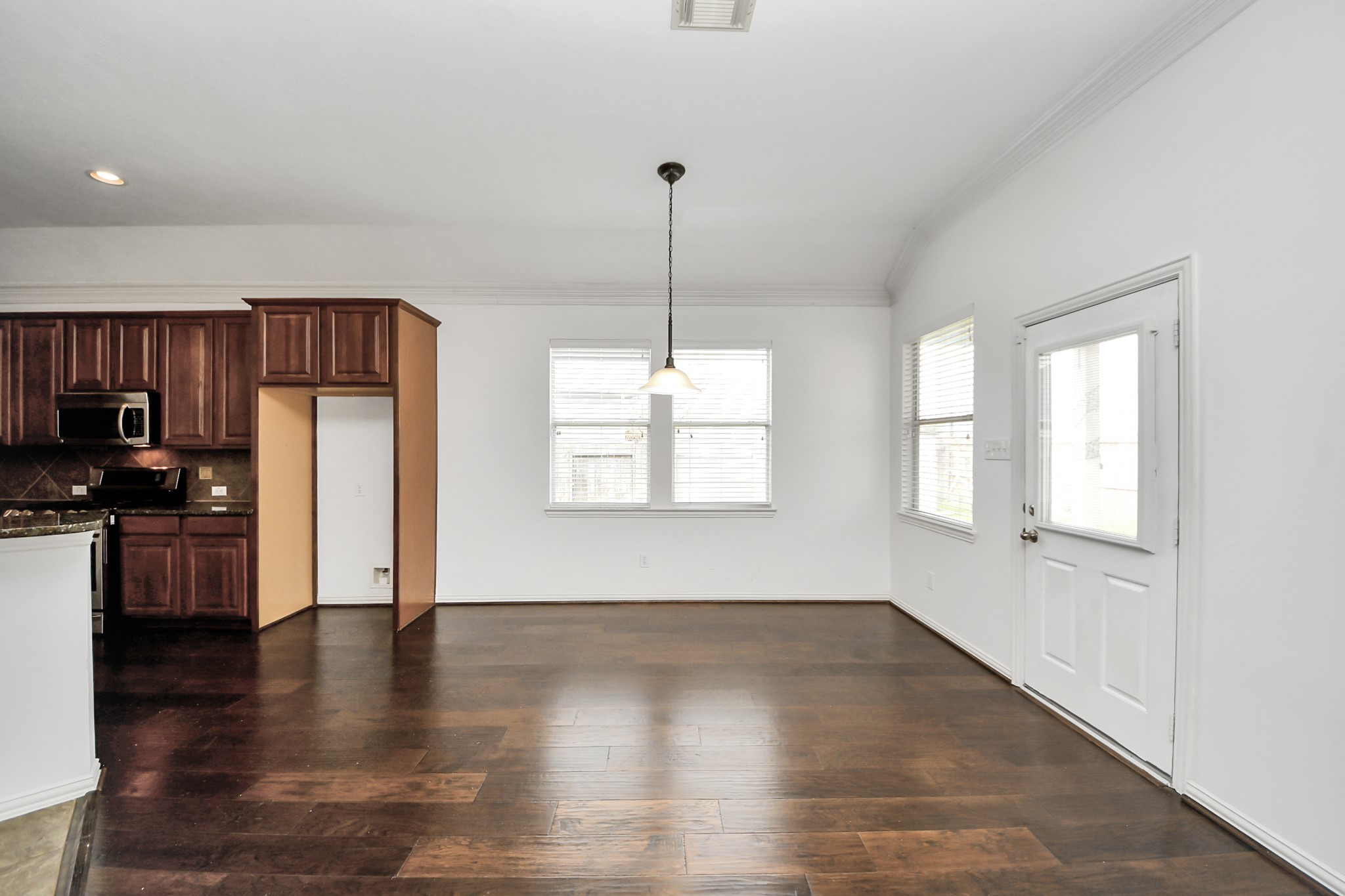 2907 Bright Sky Court Spring, TX 77386 - Photo 12 of 27 a kitchen with stainless steel appliances granite countertop a refrigerator a sink dishwasher a stove and a refrigerator with wooden floor