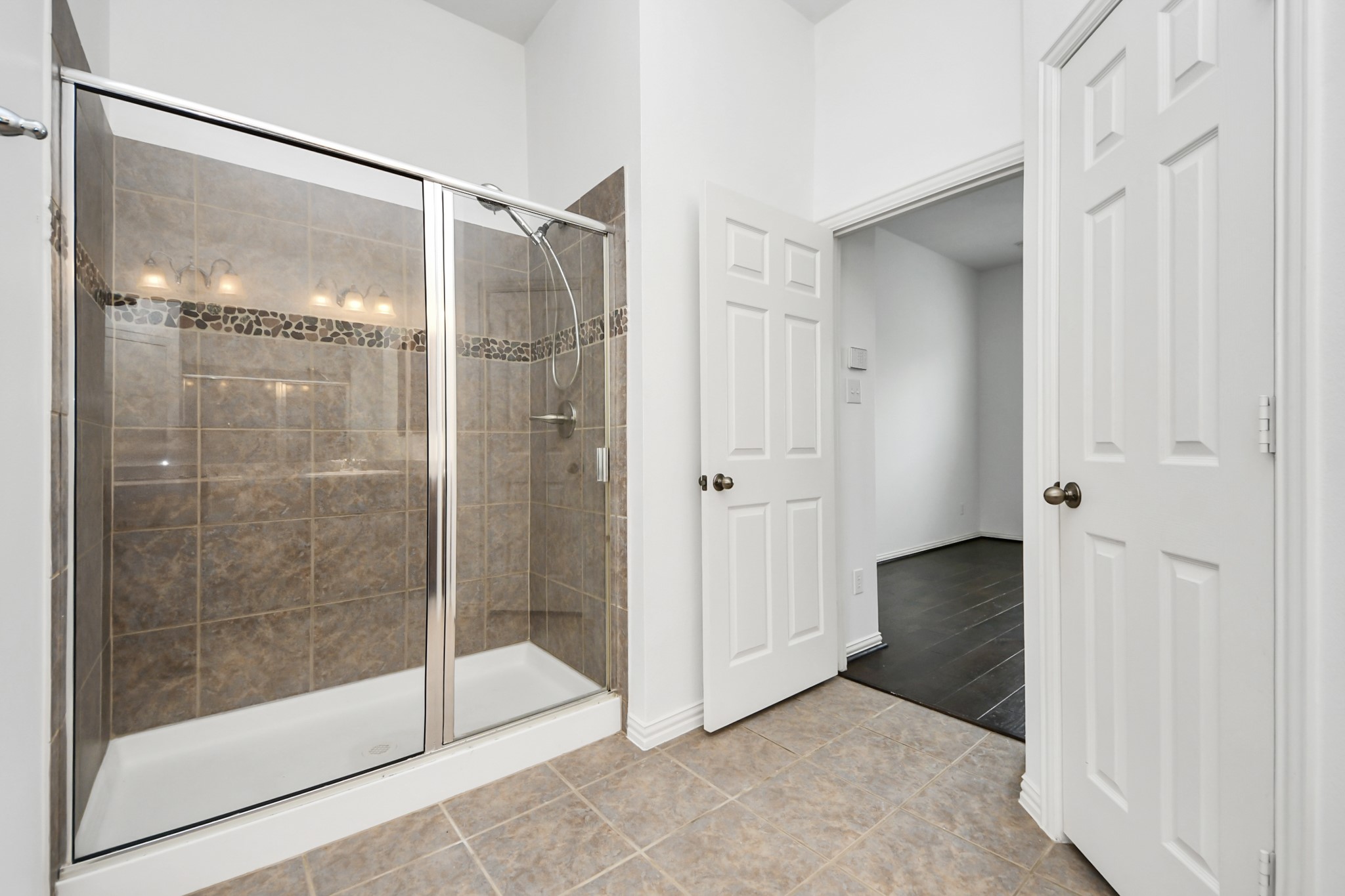 2907 Bright Sky Court Spring, TX 77386 - Photo 18 of 27 a bathroom that has a glass shower door