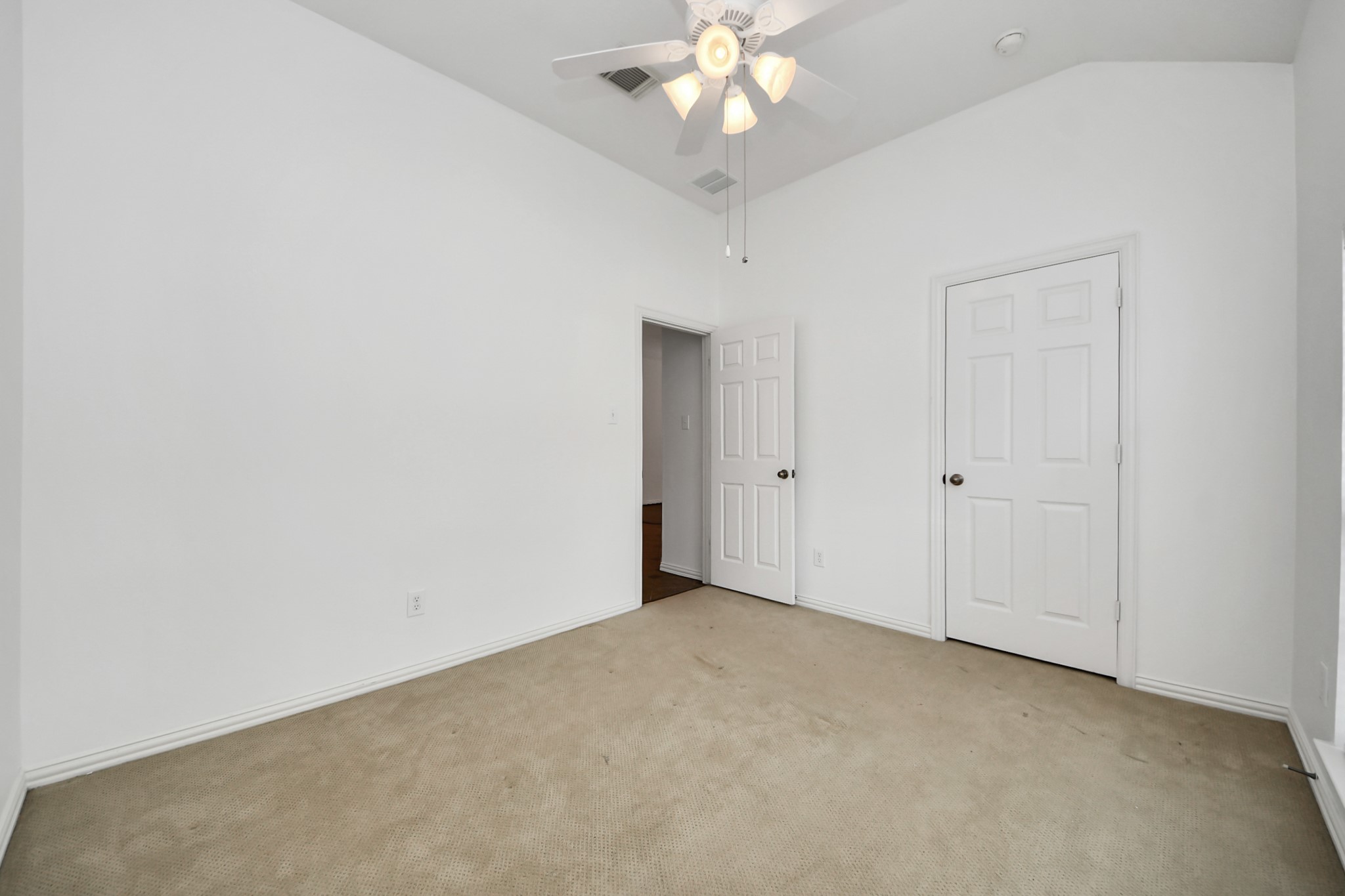 2907 Bright Sky Court Spring, TX 77386 - Photo 20 of 27 an empty room with a chandelier fan