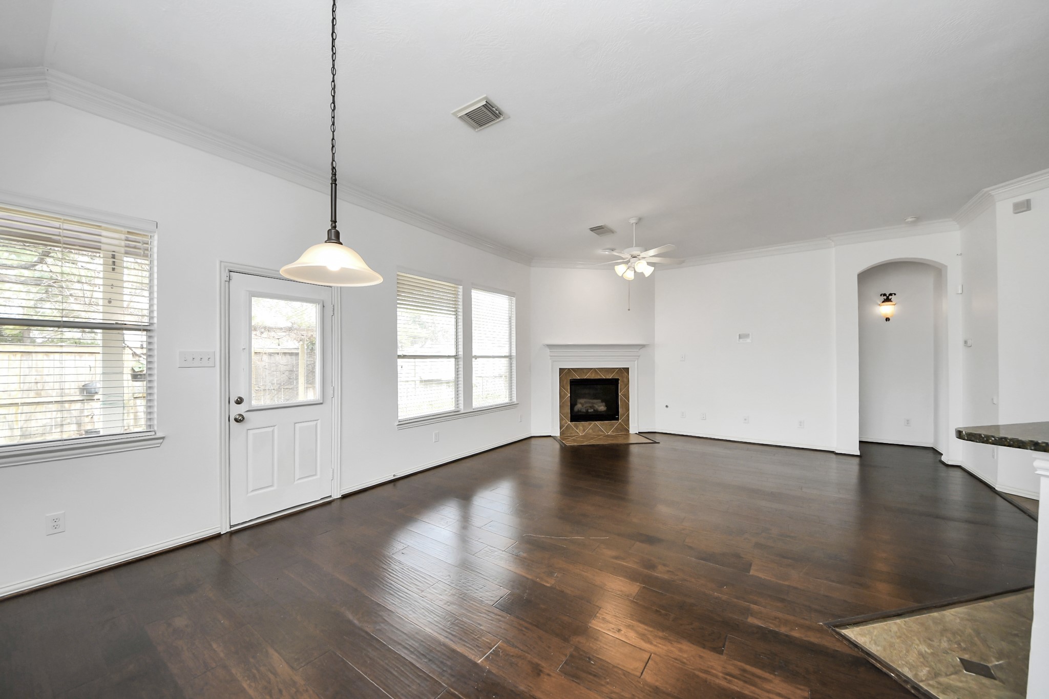 2907 Bright Sky Court Spring, TX 77386 - Photo 5 of 27 a view of an empty room with wooden floor and a window