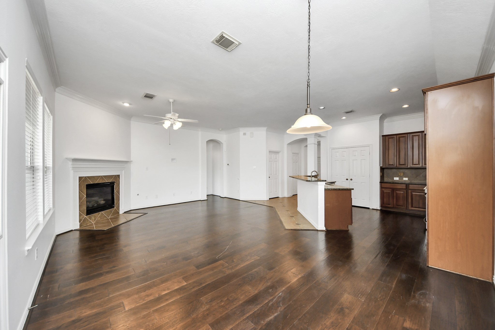 2907 Bright Sky Court Spring, TX 77386 - Photo 6 of 27 a view of a kitchen and an empty room with wooden floor