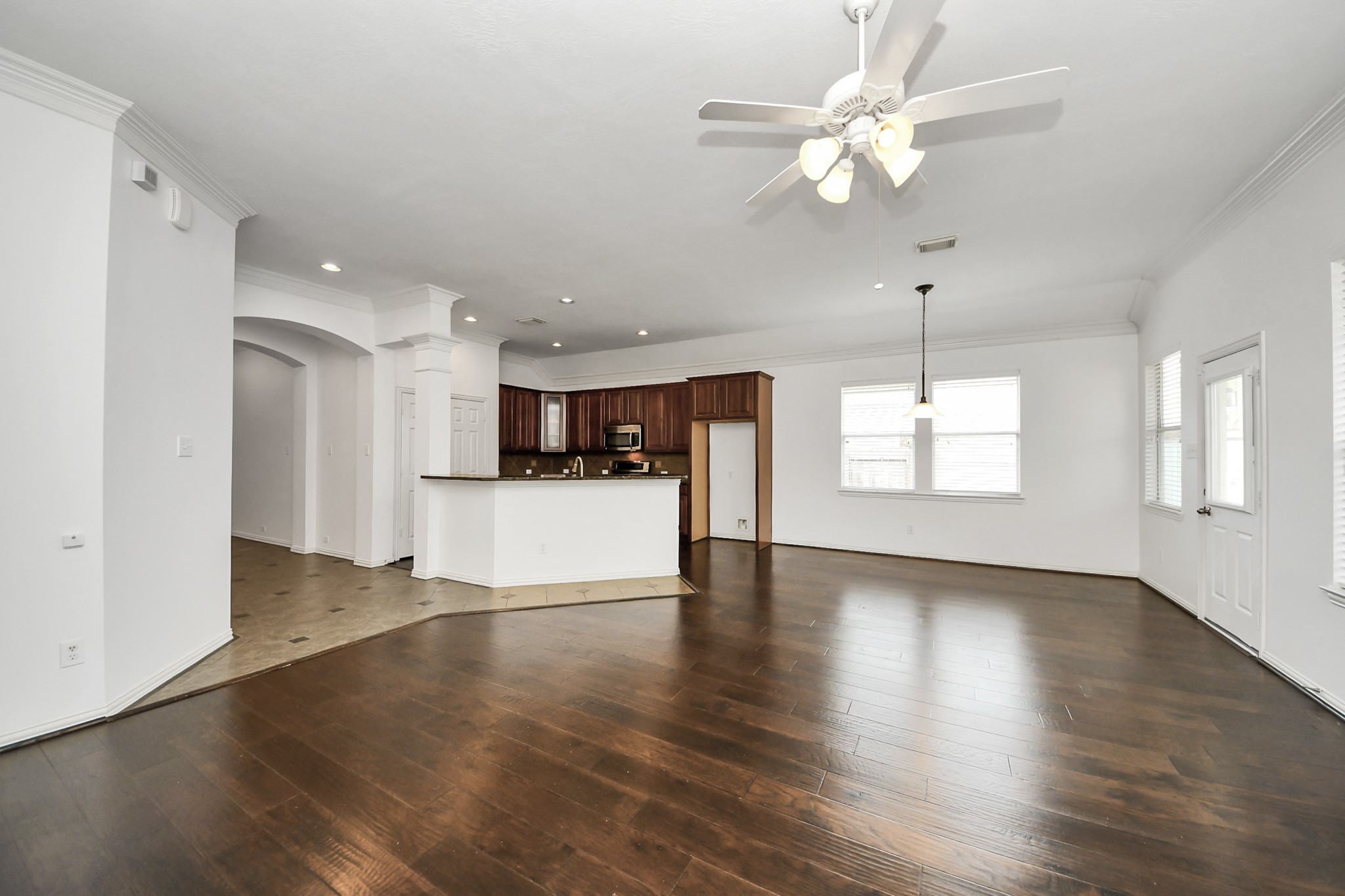 2907 Bright Sky Court Spring, TX 77386 - Photo 7 of 27 a view of an empty room with window and wooden floor
