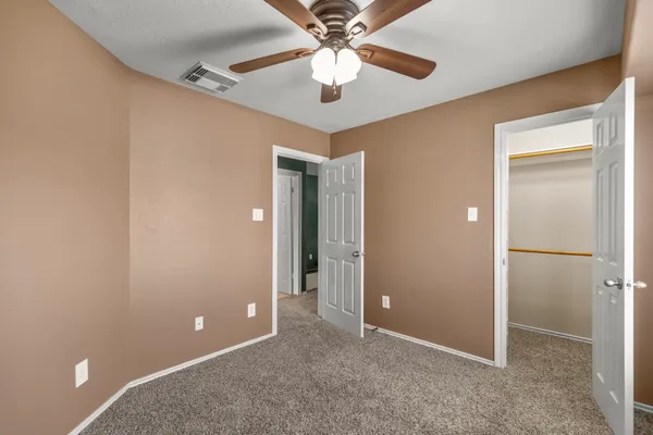 a bathroom with a sink toilet vanity and tub