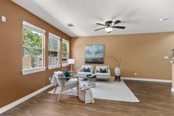 a living room with furniture and a window