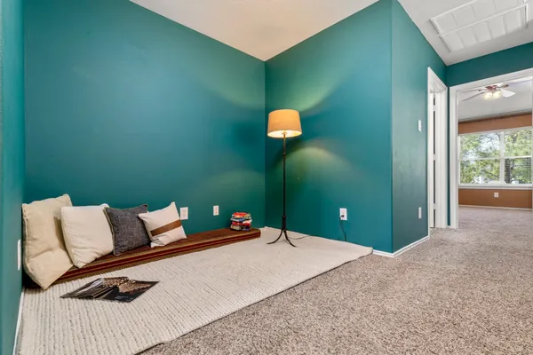 a spacious bathroom with a tub sink shower and mirror