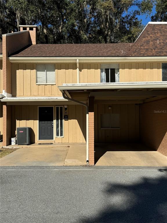 507 Northwest 39th Road, Unit 159 Gainesville, FL 32607 - Photo 1 of 1 a front view of a house with a yard