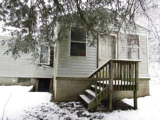 a view of a wooden deck and a patio