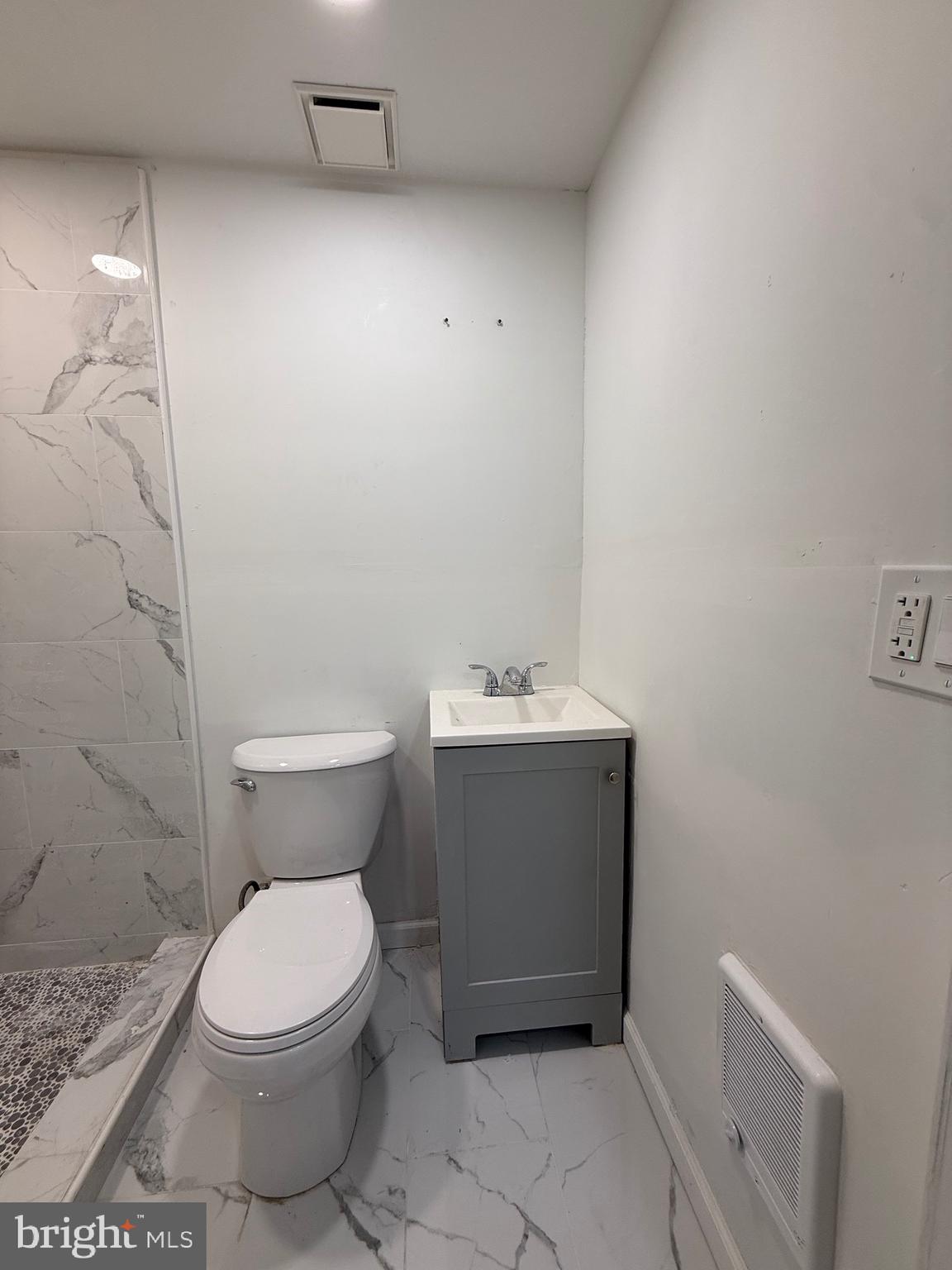 1153 Atwood Road, Unit 2 Philadelphia, PA 19151 - Photo 11 of 29 a bathroom with a toilet and a sink