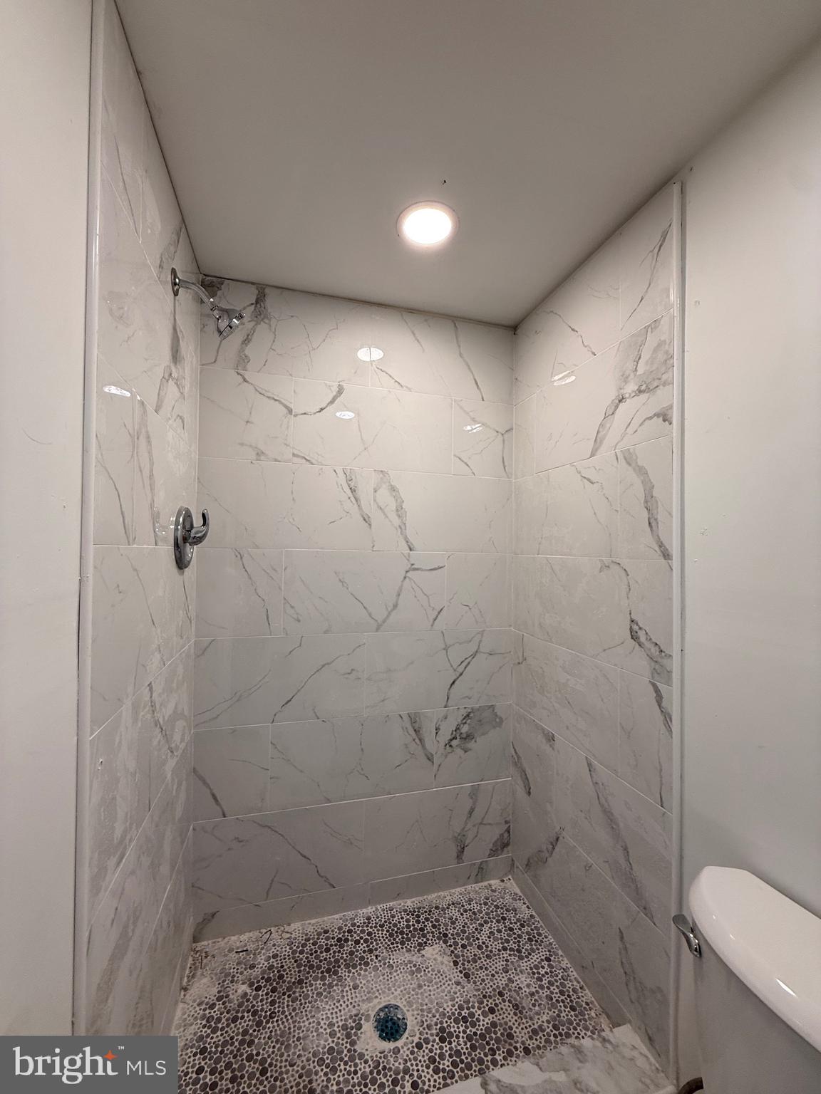 1153 Atwood Road, Unit 2 Philadelphia, PA 19151 - Photo 12 of 29 a bathroom with a shower and a toilet