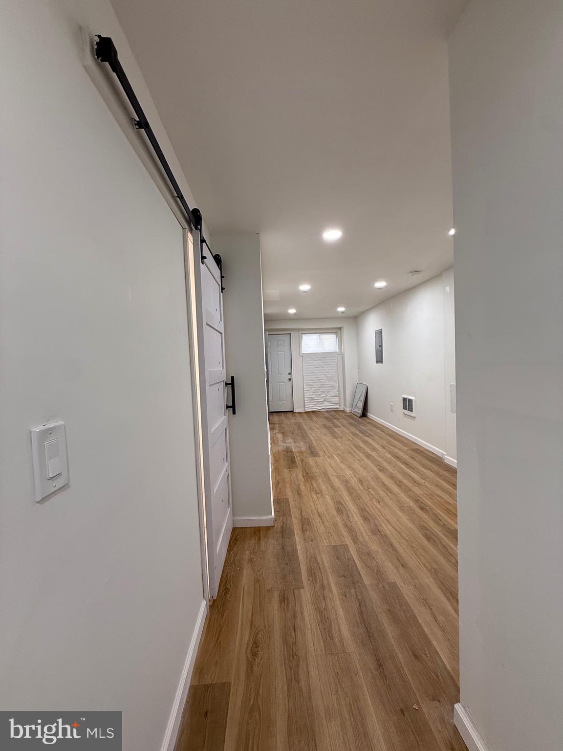 1153 Atwood Road, Unit 2 Philadelphia, PA 19151 - Photo 19 of 29 a view of a hallway with wooden floor