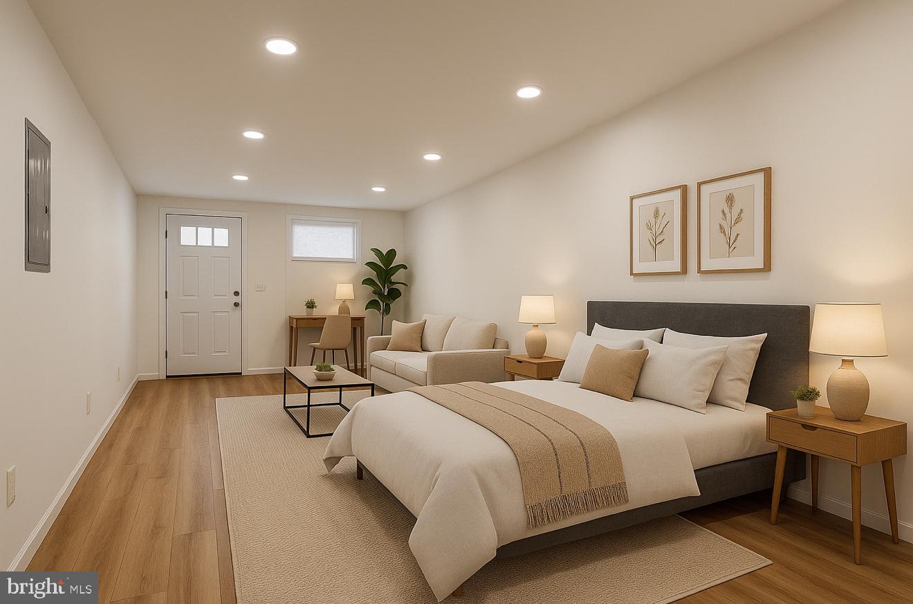 1153 Atwood Road, Unit 2 Philadelphia, PA 19151 - Photo 2 of 29 a spacious bedroom with two beds and a table