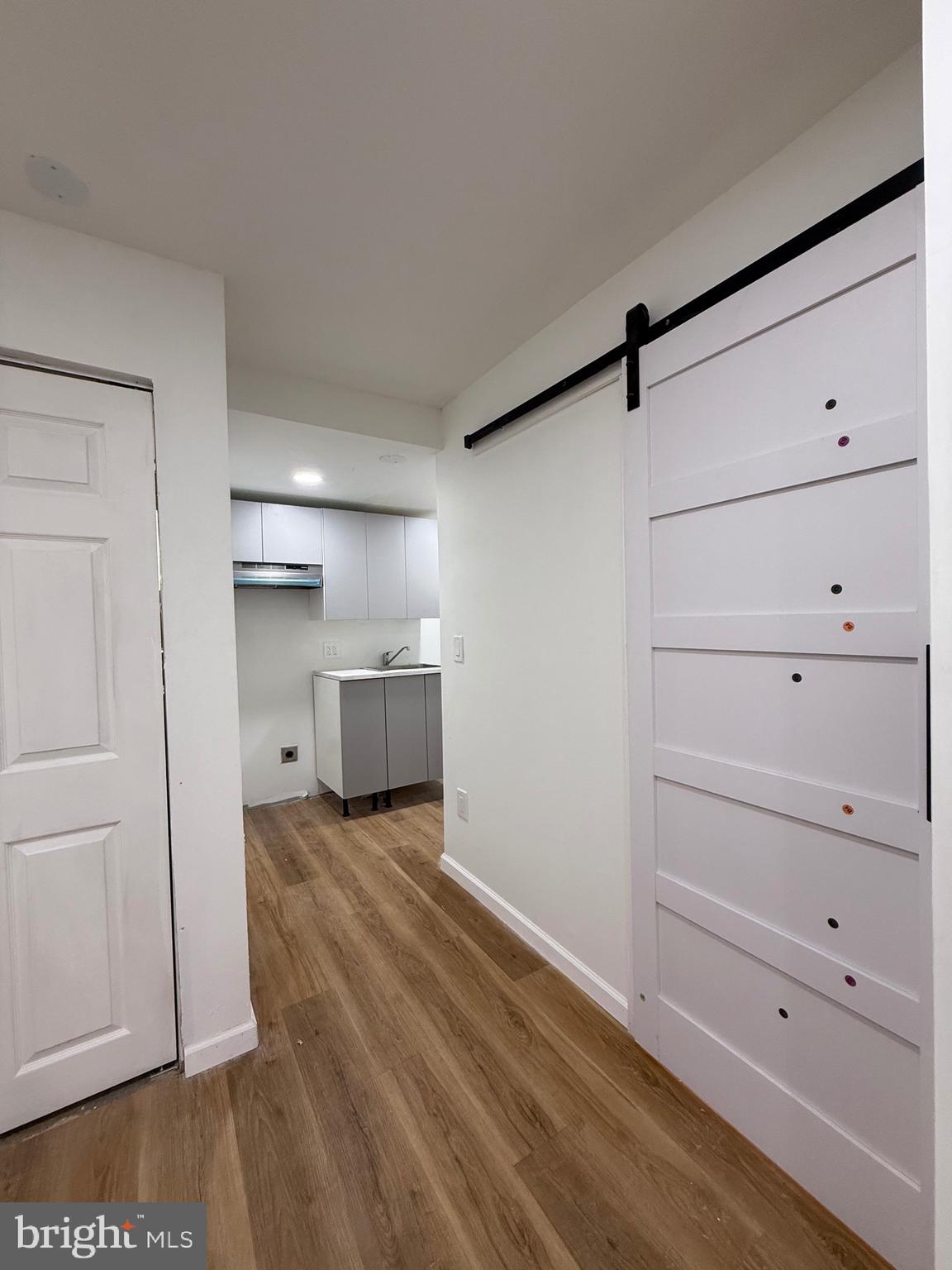 1153 Atwood Road, Unit 2 Philadelphia, PA 19151 - Photo 24 of 29 a view of a room with cabinet and mirror