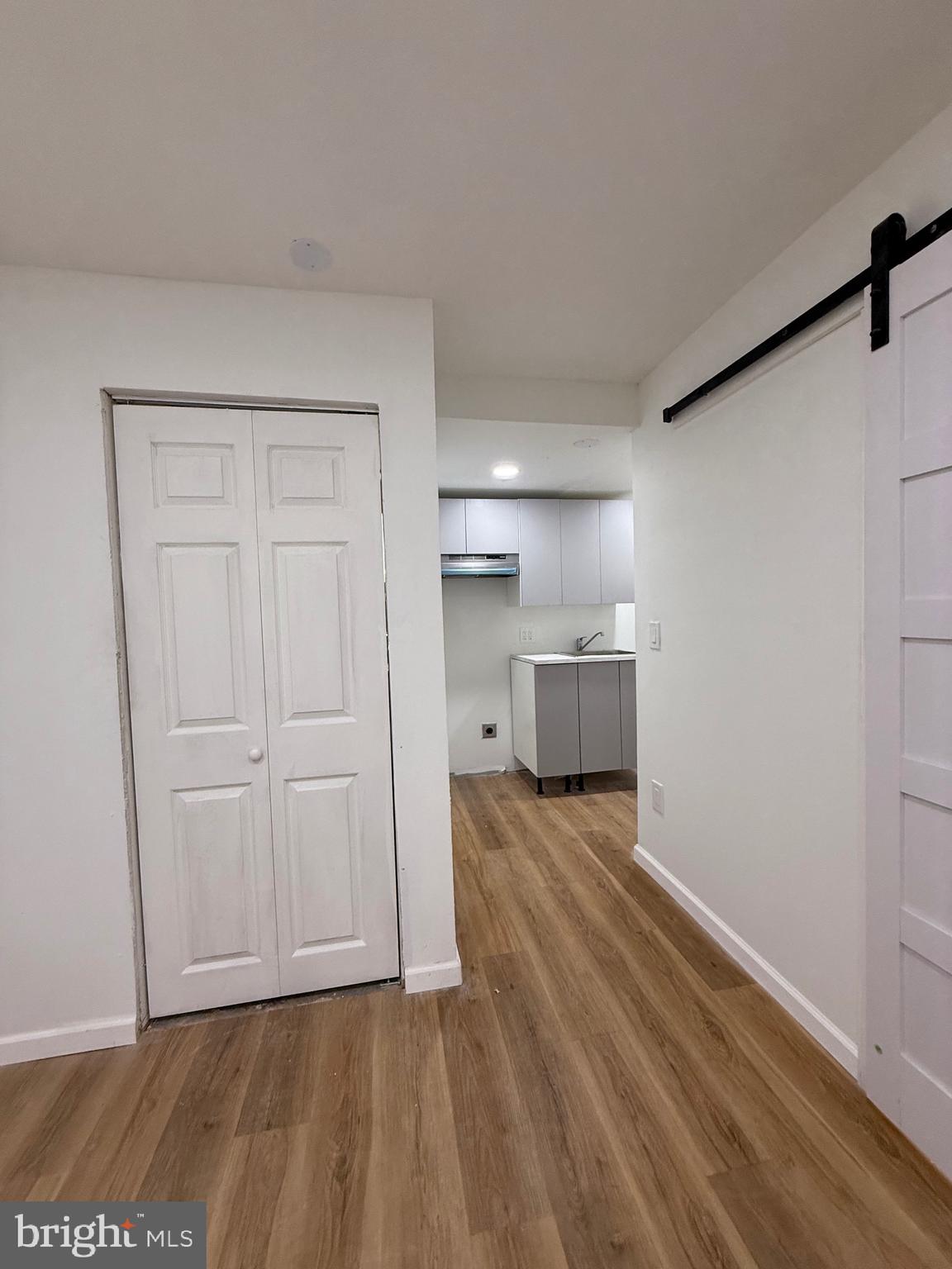 1153 Atwood Road, Unit 2 Philadelphia, PA 19151 - Photo 25 of 29 a view of a kitchen with a sink and a refrigerator