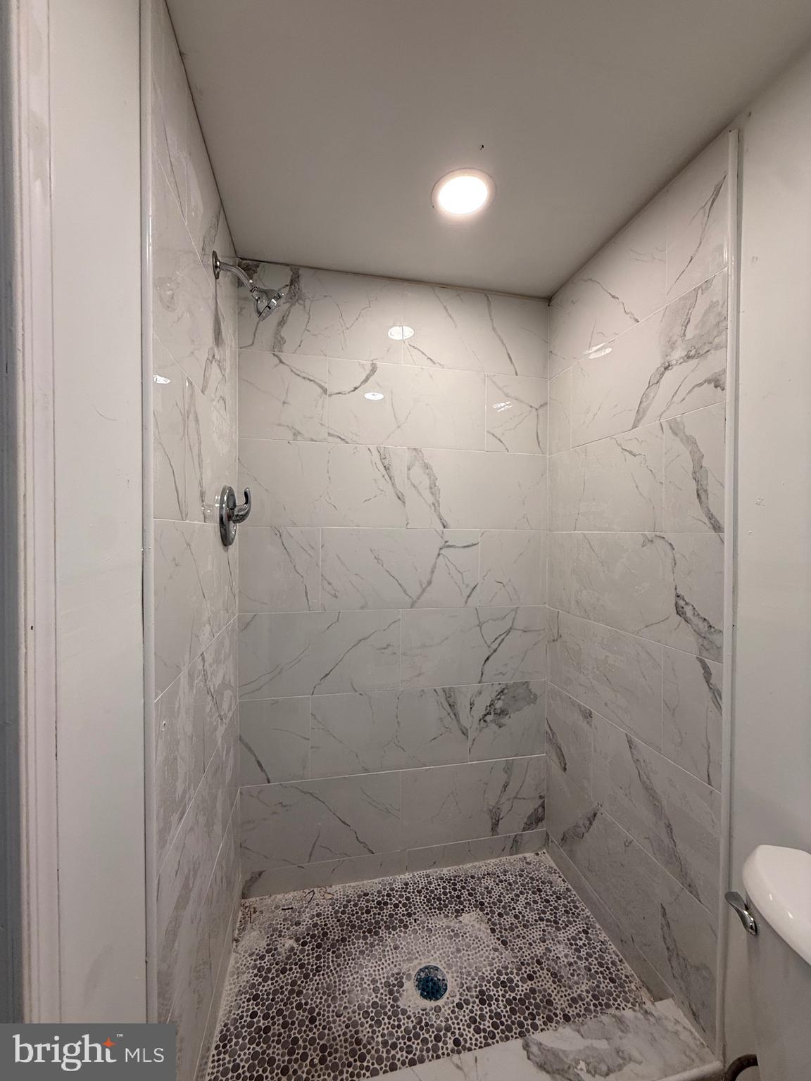 1153 Atwood Road, Unit 2 Philadelphia, PA 19151 - Photo 9 of 29 a bathroom with a shower and a toilet