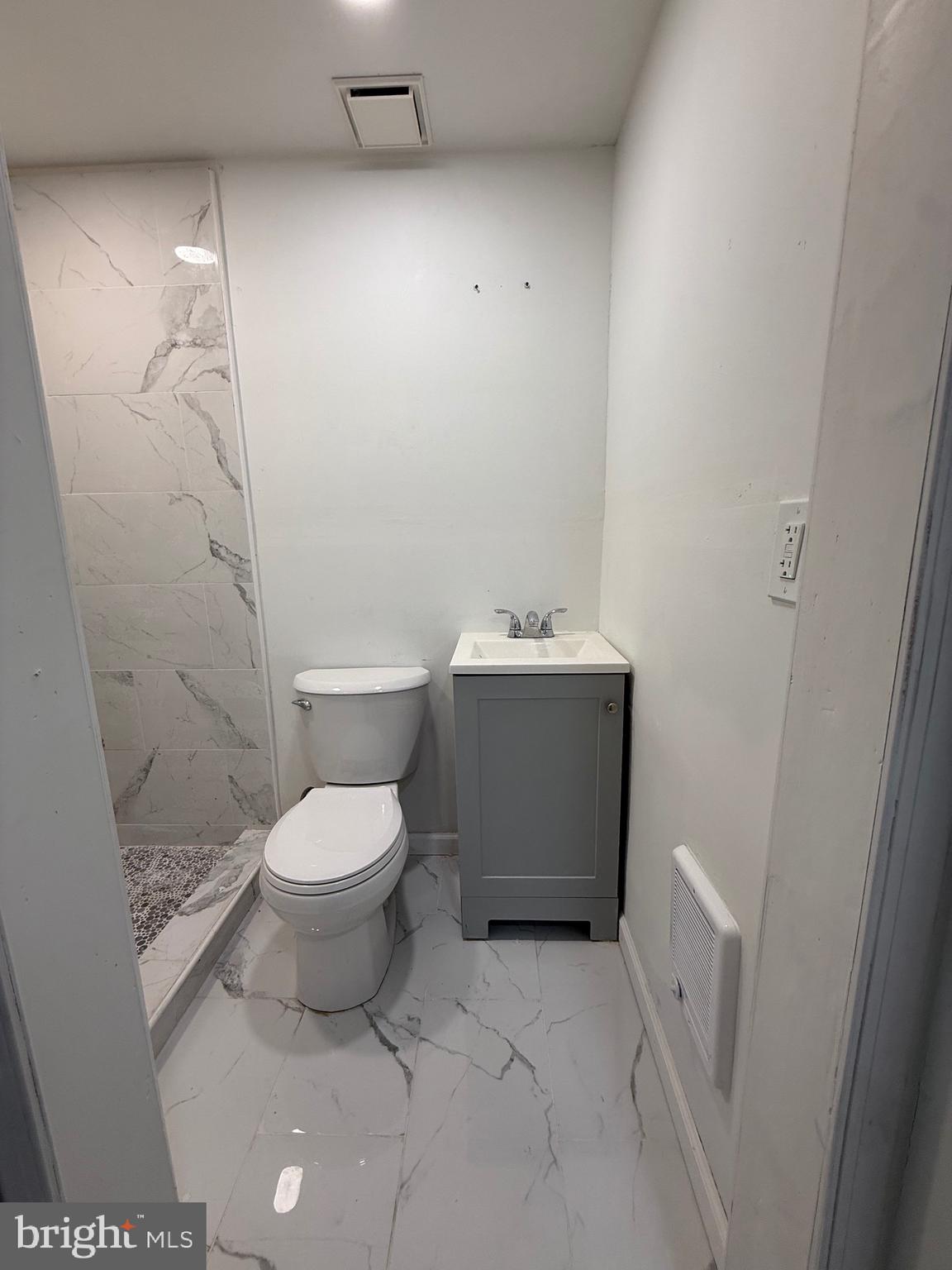 1153 Atwood Road, Unit 2 Philadelphia, PA 19151 - Photo 10 of 29 a bathroom with a toilet and a sink