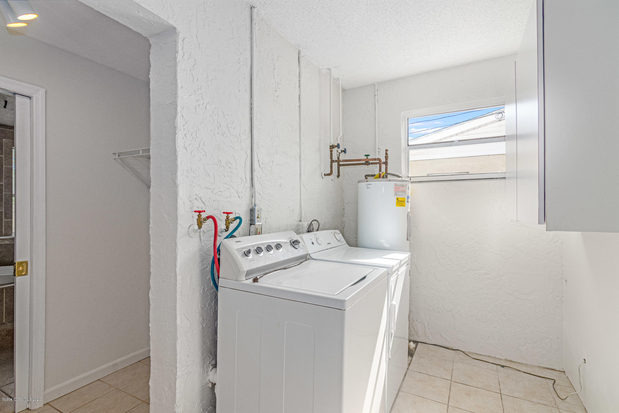 434 Count Street Melbourne, FL 32901 - Photo 13 of 26 a utility room with dryer and washer