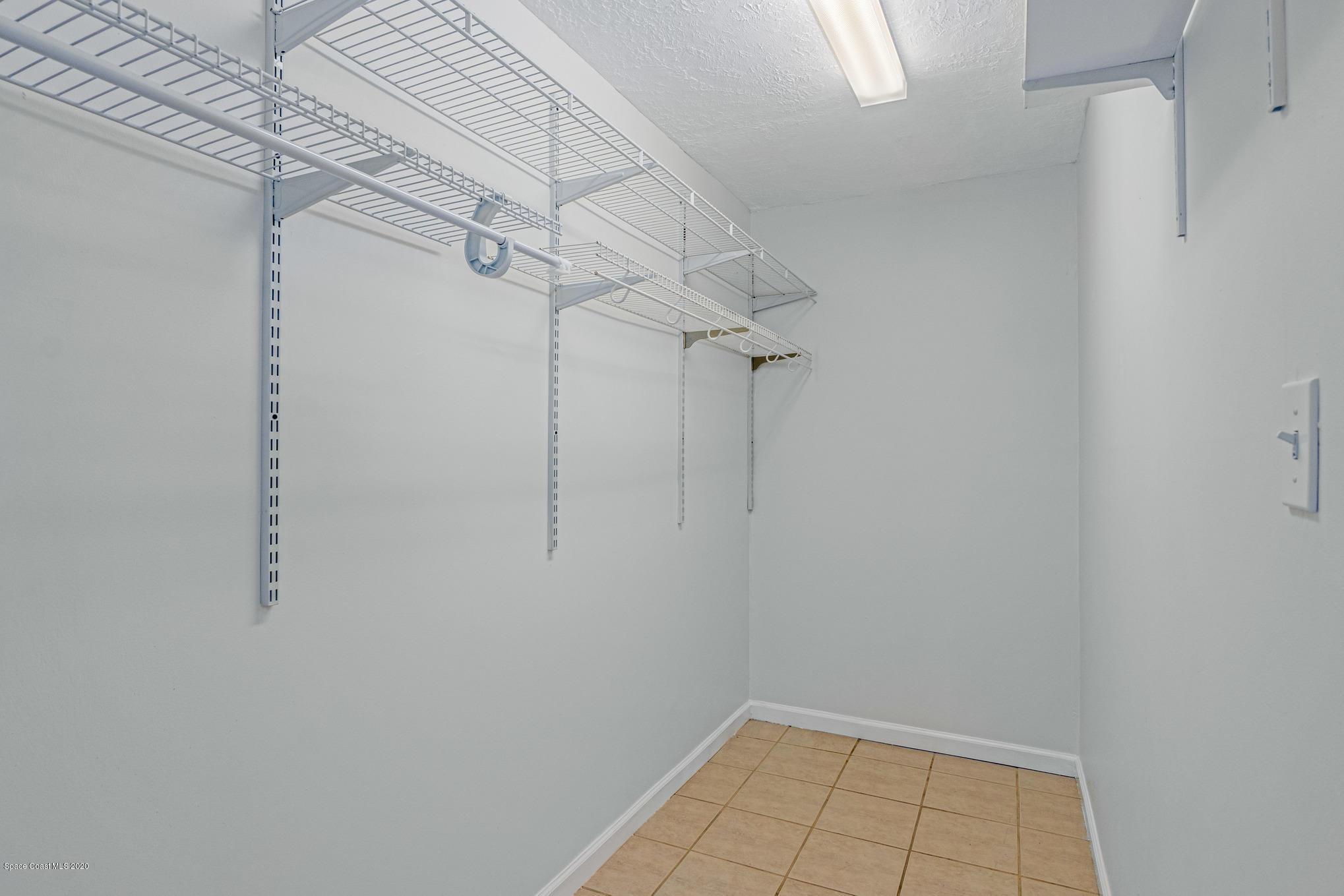 434 Count Street Melbourne, FL 32901 - Photo 14 of 26 a view of a room with racks on the wall