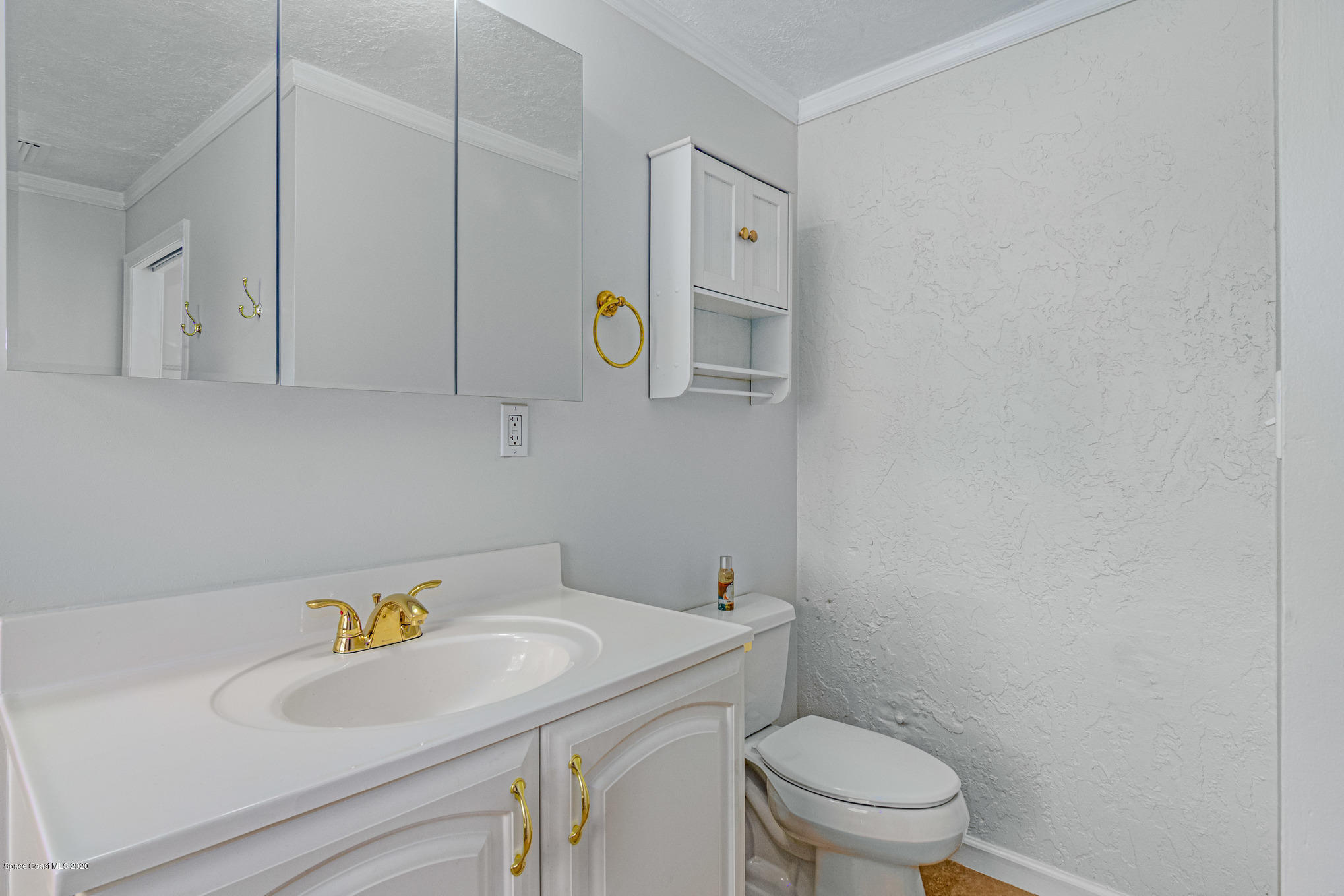 434 Count Street Melbourne, FL 32901 - Photo 16 of 26 a bathroom with a sink a toilet and a shower