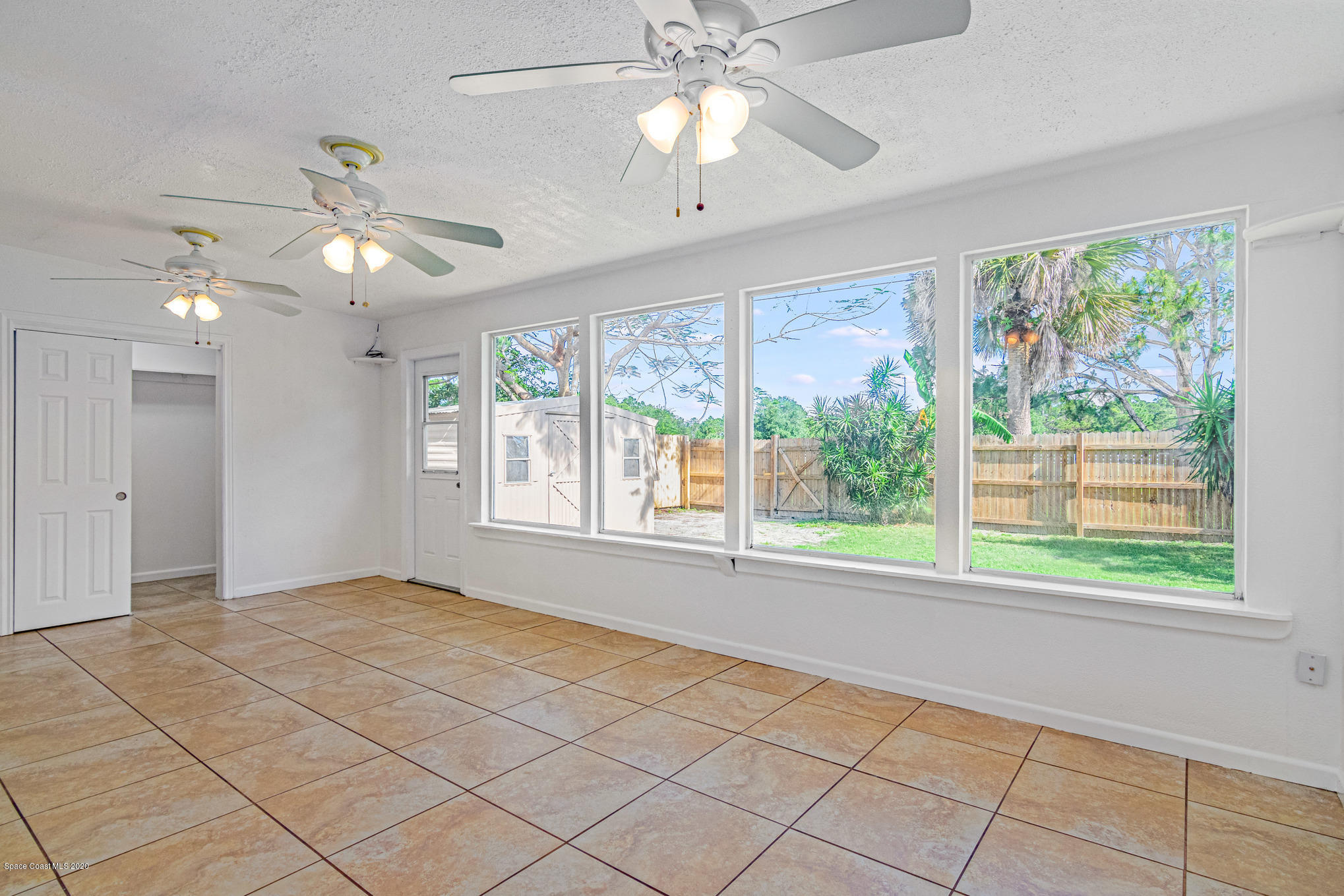 434 Count Street Melbourne, FL 32901 - Photo 22 of 26 a view of an empty room with a window and kitchen view