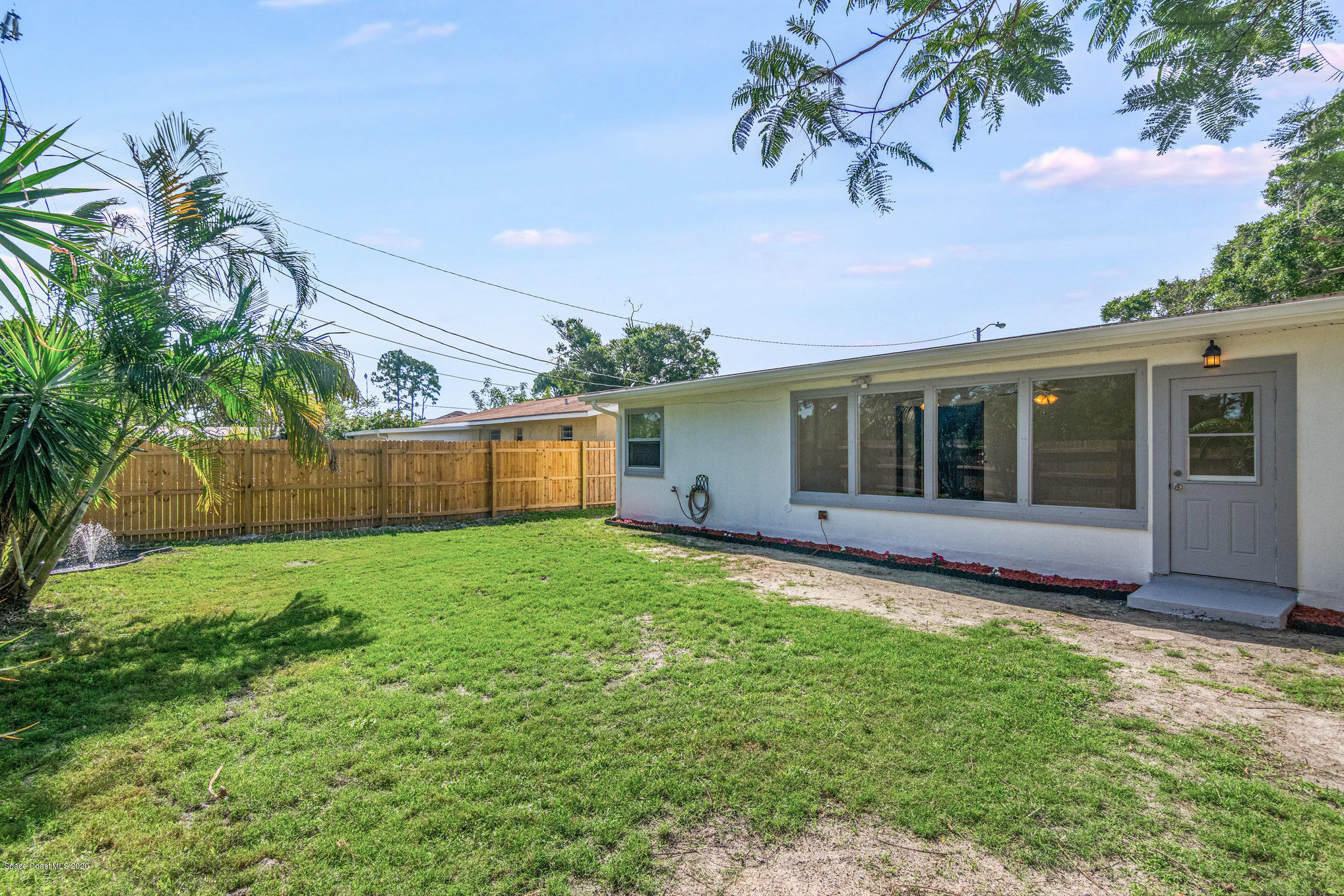 434 Count Street Melbourne, FL 32901 - Photo 24 of 26 a view of a house with a yard and a garden