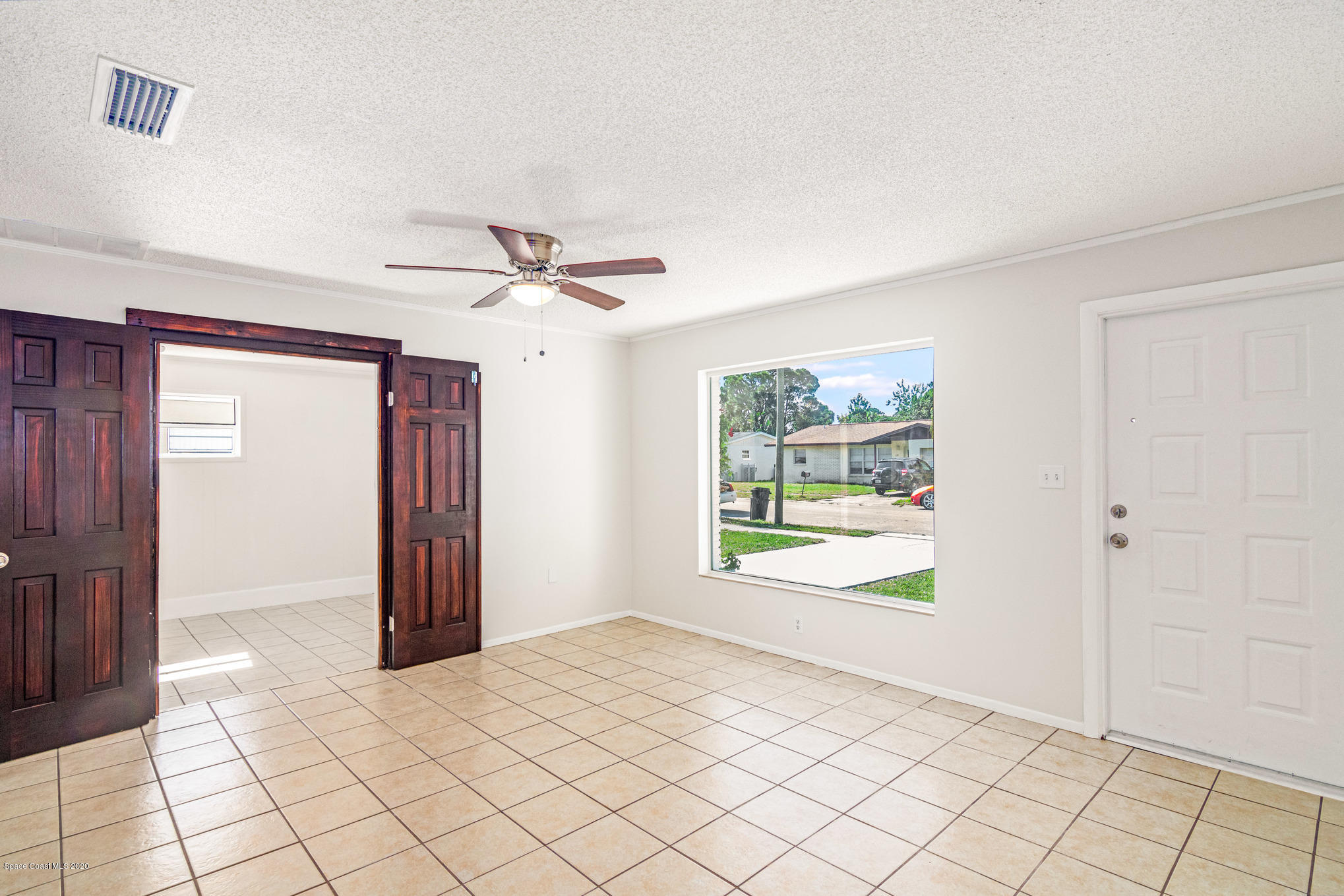 434 Count Street Melbourne, FL 32901 - Photo 4 of 26 a view of an empty room with a window