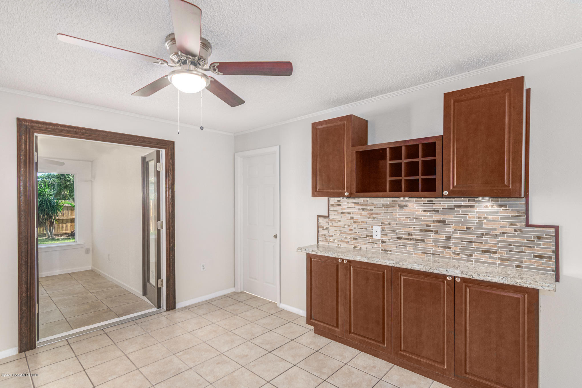 434 Count Street Melbourne, FL 32901 - Photo 8 of 26 a bathroom with a granite countertop sink and a mirror