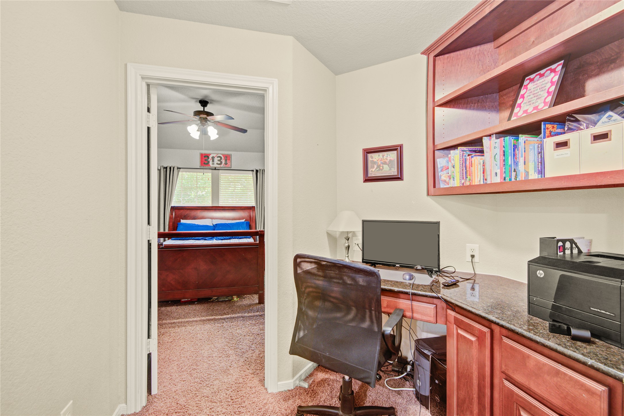 6007 Valhalla Drive Spring, TX 77379 - Photo 22 of 37 The built-in study nook creates the perfect homework station, reading area, or creative workspace between the secondary bedrooms.