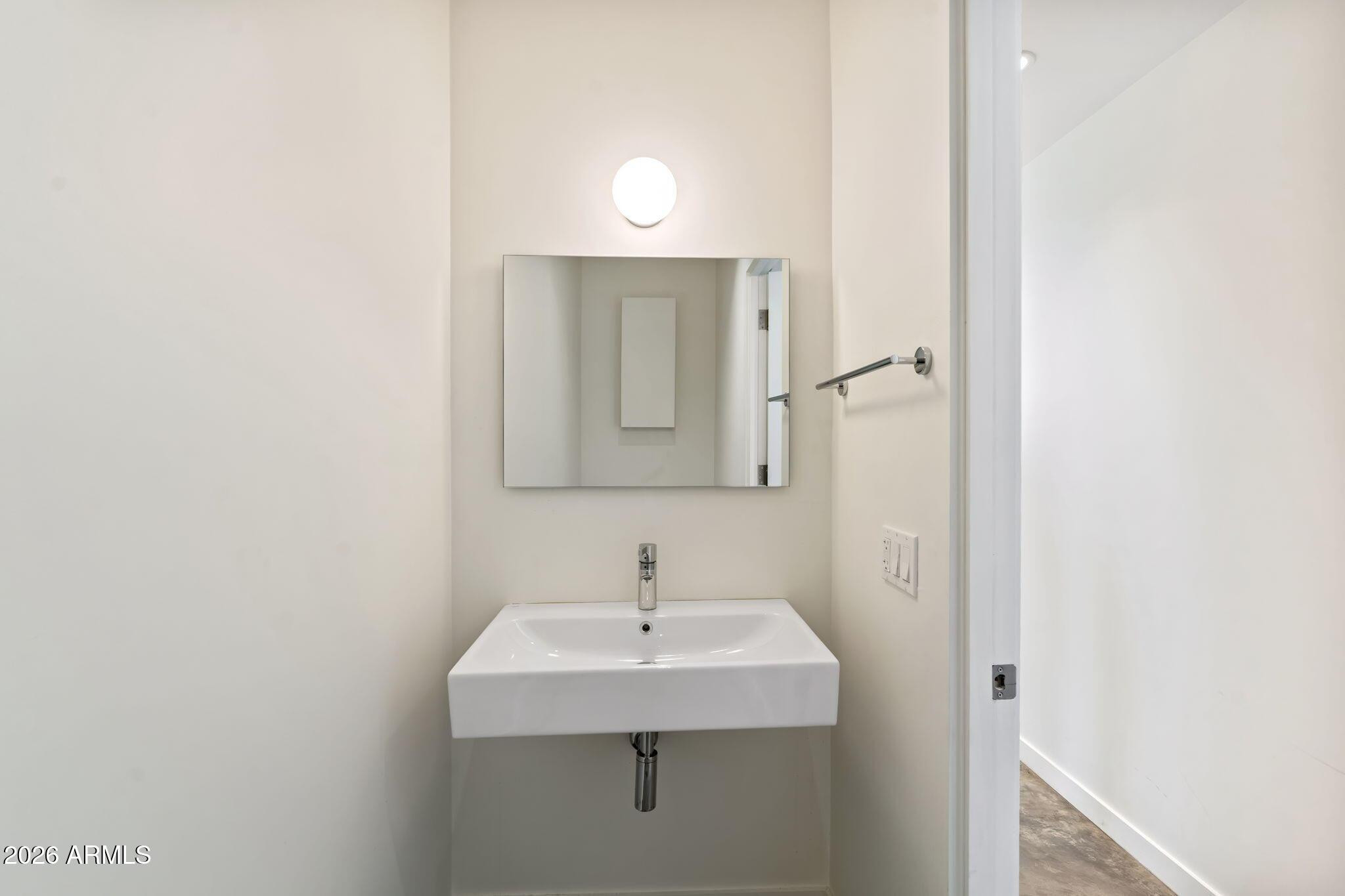 1337 East Polk Street, Unit 7 Phoenix, AZ 85006 - Photo 13 of 25 a bathroom with a sink and a mirror