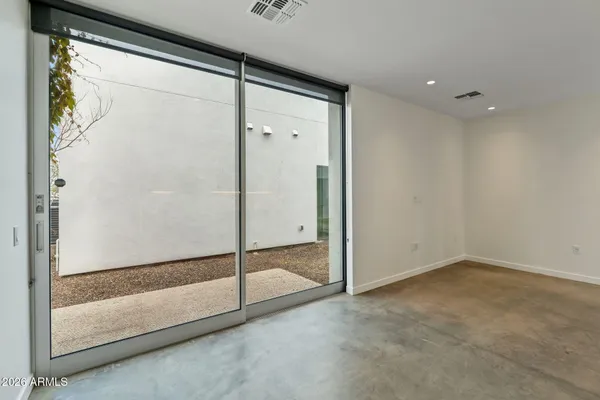 a kitchen with stainless steel appliances a refrigerator and a stove top oven