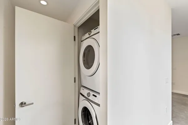a view of a kitchen with a sink and refrigerator