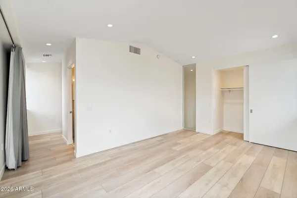 an empty room with a wooden door