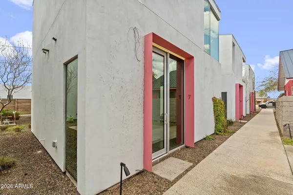 a spacious bathroom with a double vanity sink toilet mirror and shower