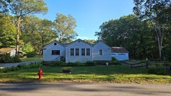 288 High Street Uxbridge, MA 01569 - Photo 11 of 24 a front view of a house with a yard