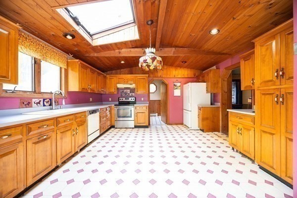 288 High Street Uxbridge, MA 01569 - Photo 14 of 24 a large kitchen with lots of counter space and windows