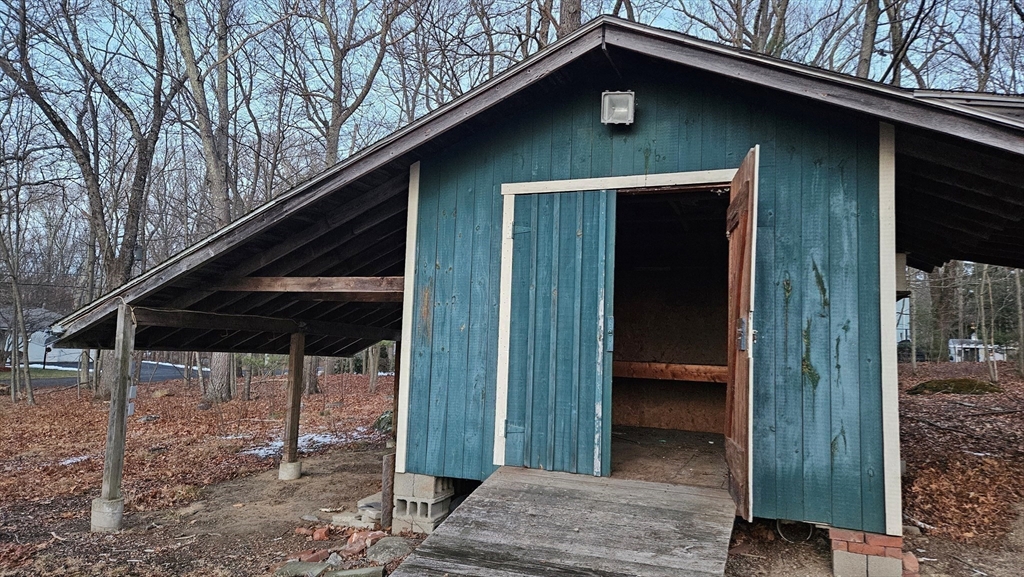 288 High Street Uxbridge, MA 01569 - Photo 24 of 24 a backyard of a house with table and chairs